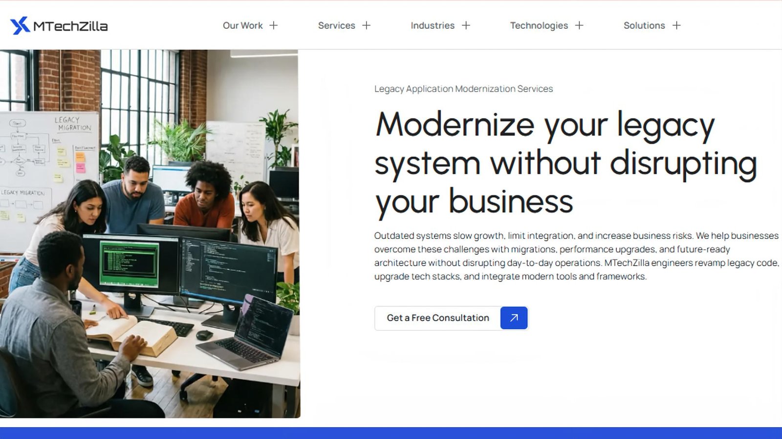 Legacy modernisation service page headed 'Modernize your legacy system without disrupting your business' beside a team reviewing code at a legacy-migration whiteboard